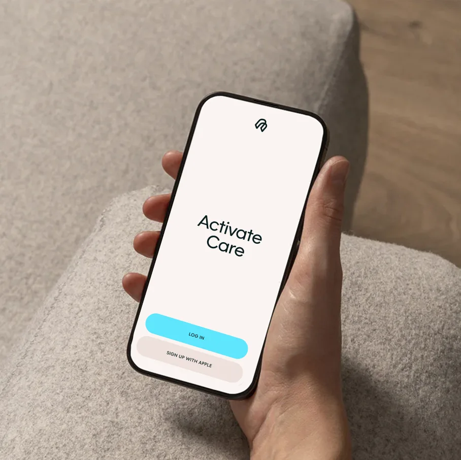 Hand holding a smartphone with the Near Health app